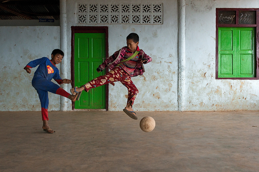 Superman plays Football