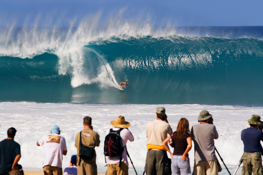 Surfing photographers in action at the Pipeline Masters on Oahu Island, Hawaii.