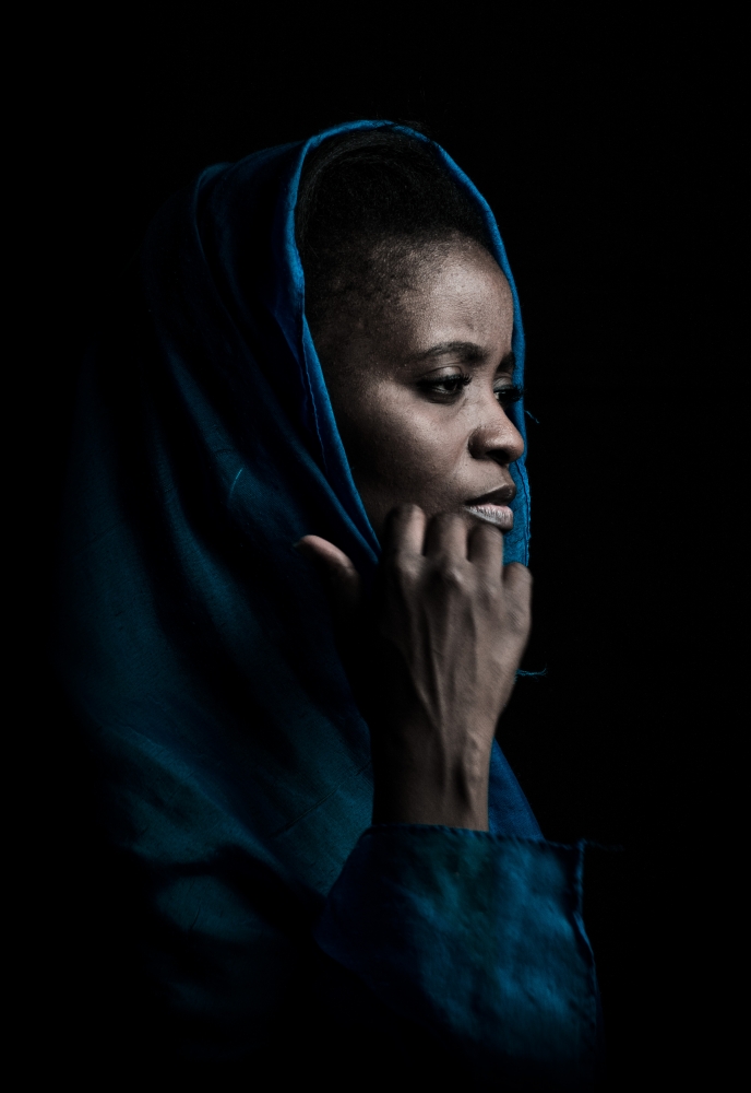 Black woman with blue drape