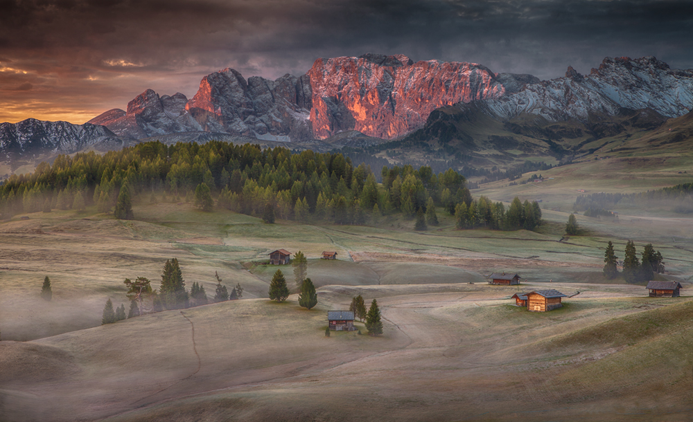 Burning mountains over the frozen valley