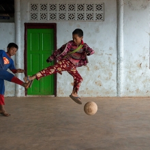 Superman plays Football