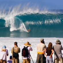 Surfing photographers in action at the Pipeline Masters on Oahu Island, Hawaii.