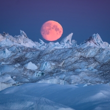 Moon rising over Icebergs in Ilulissat Icefjord, Greenland